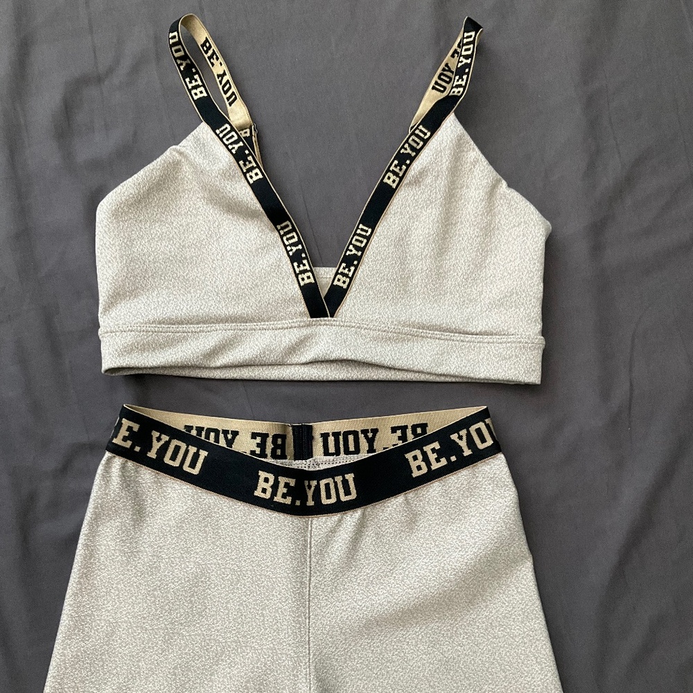 Be You sports bra and shorts athletic outfit in gold and black, size medium